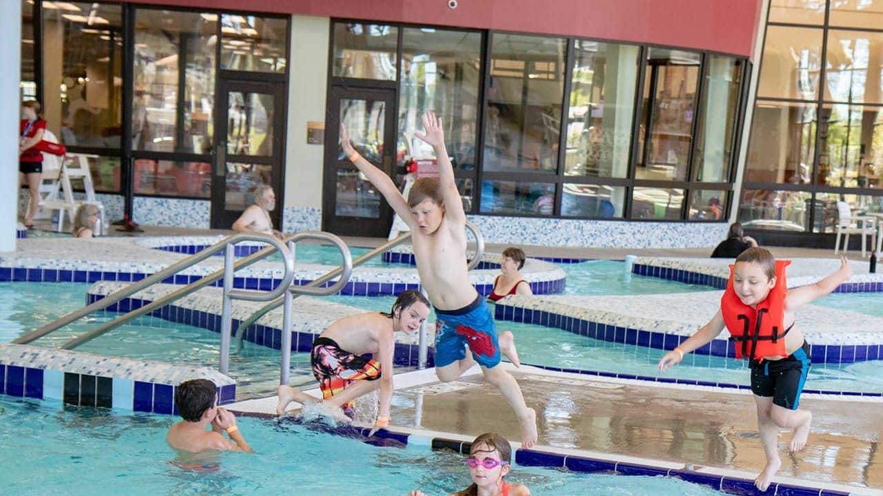 Children playing in the Cove Pool during Camp Kroc day camp.