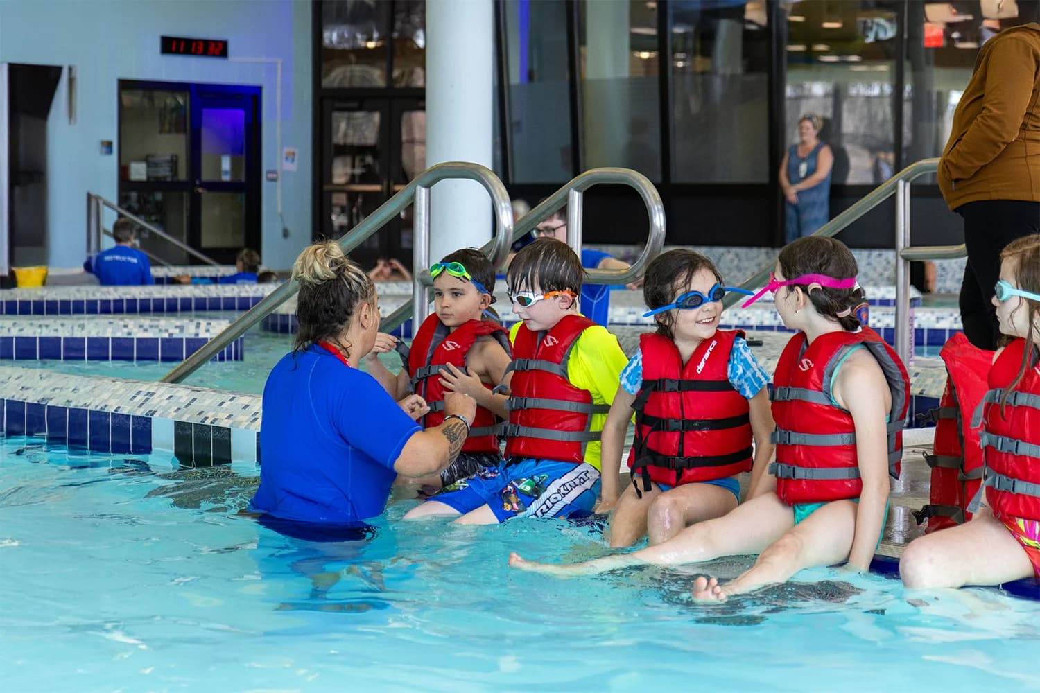 Students learning life-saving swimming skills during the 3rd Grade Swim program.