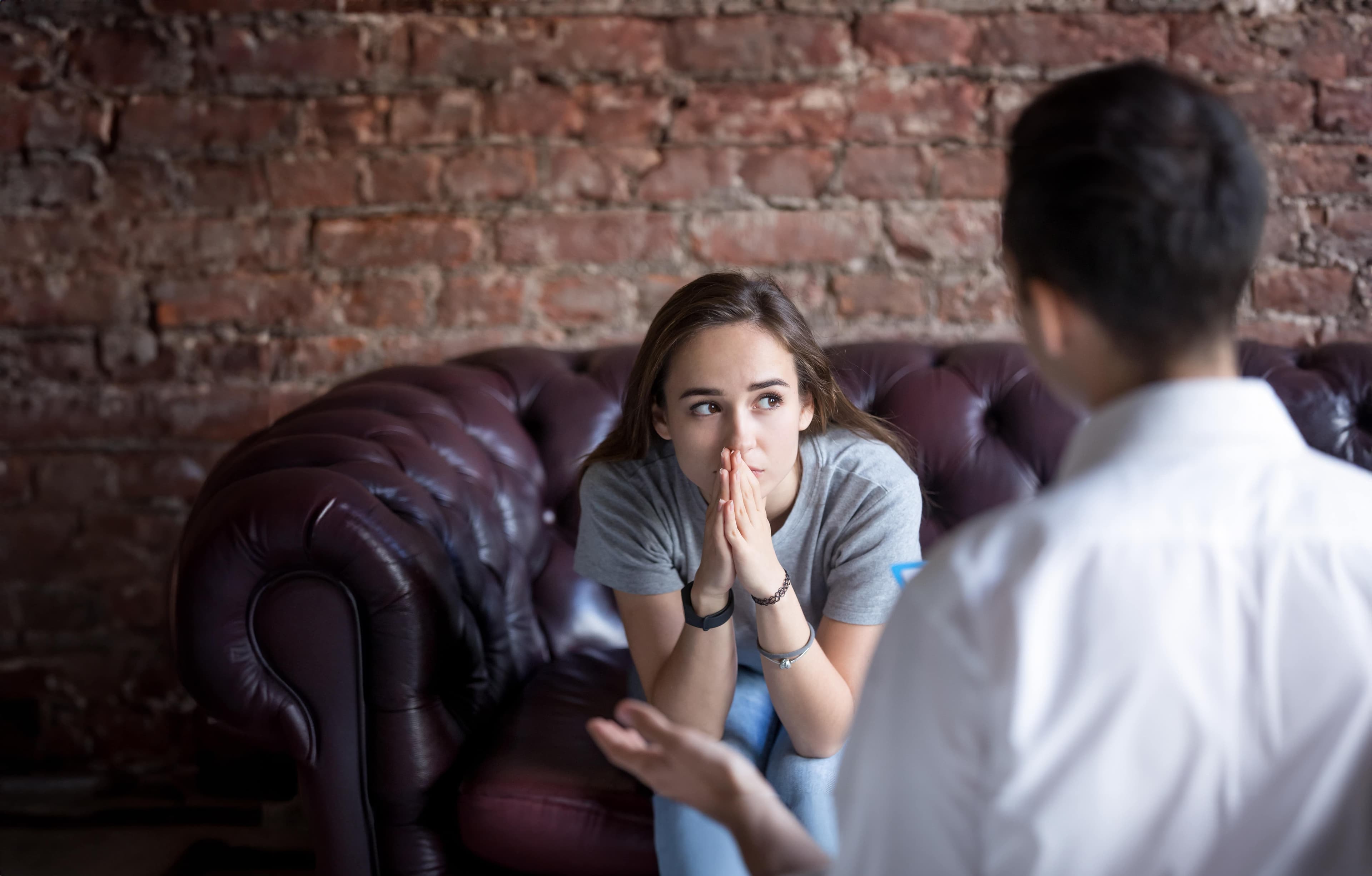 Image of adult speaking with teenager about mental health.
