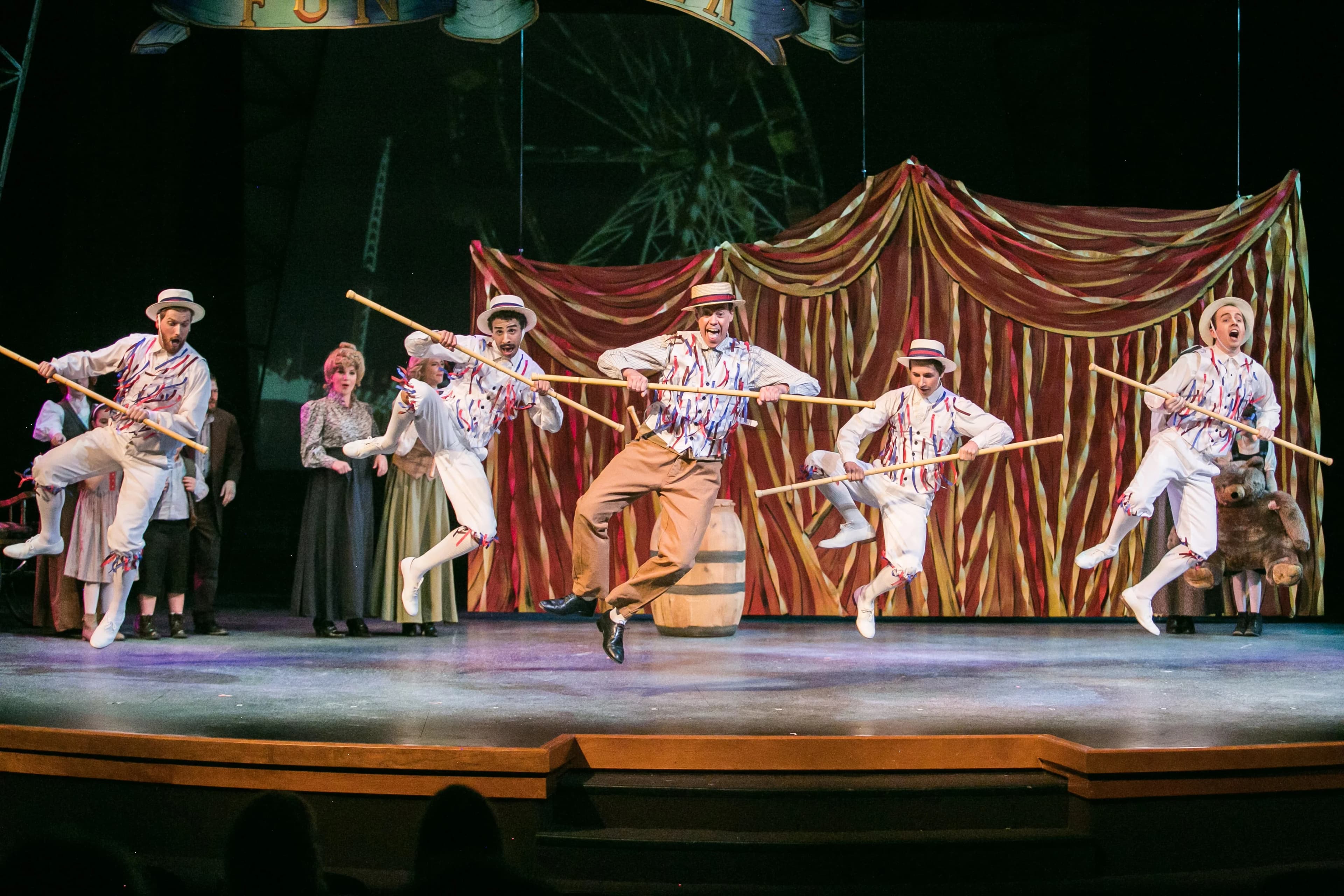 A theater company performing a song and dance in The Midge & Pepper Smock Family Theatre at The Kroc.